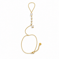 A delicate gold chain bracelet featuring a vertical drop section with a heart-shaped clear gemstone, a row of small round clear stones, and a square clear gemstone, displayed on a solid white background.
